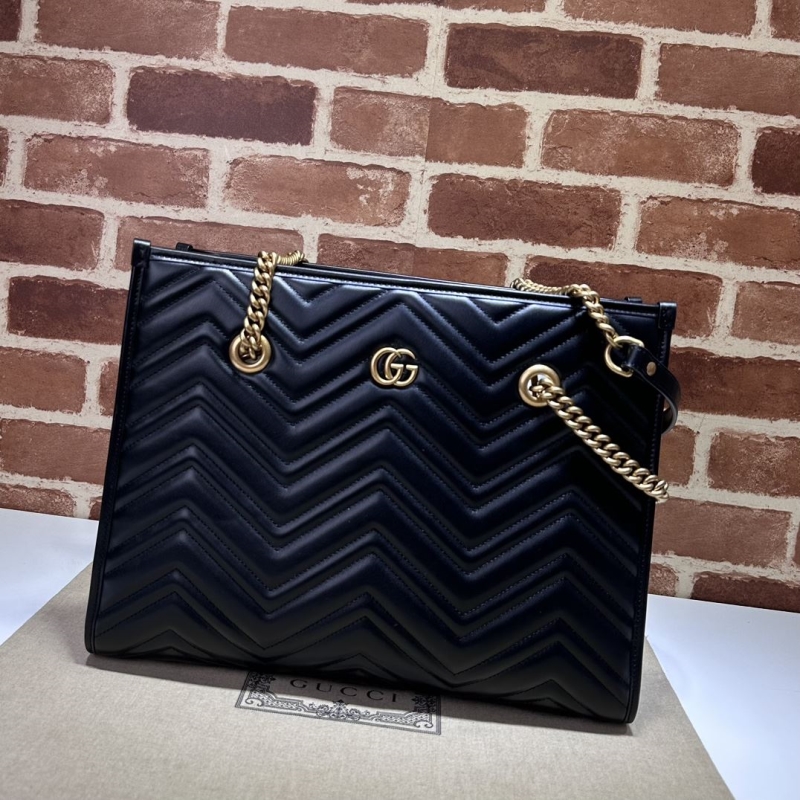 G*u*i shopping bags